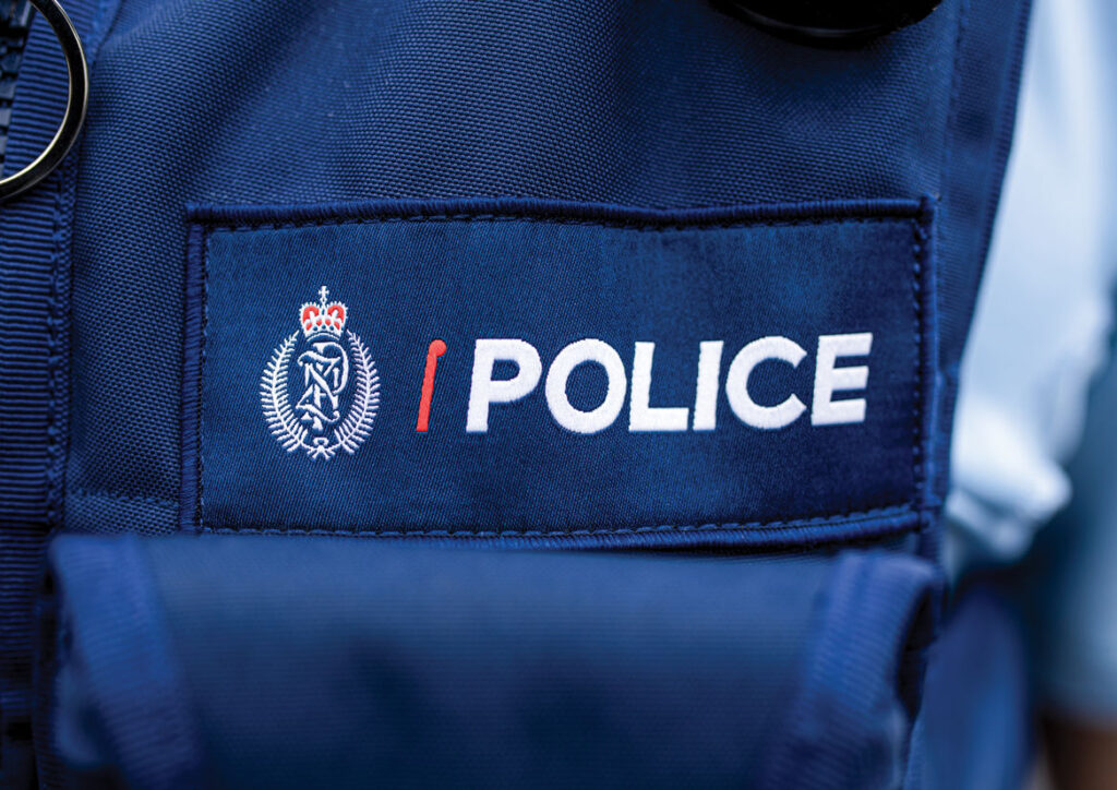 Police officers on a Wellington street during a daytime emergency response.