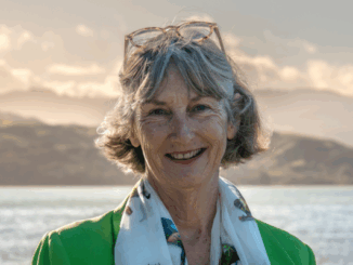 Moira Lawler speaking at her campaign launch event at the RSA in Pukerua Bay, surrounded by local residents.