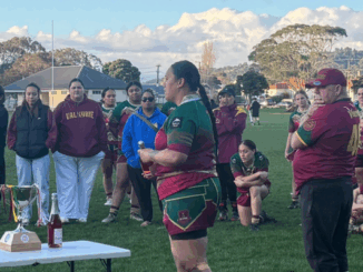 Porirua Valkyrie women's rugby league team celebrating with the Aggy Memorial Cup