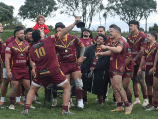 Porirua Vikings Premier team celebrating their Tier 2 Division rugby league win with trophy and medals.