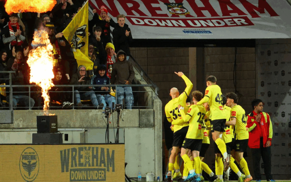 Wellington Phoenix players celebrate a goal against Wrexham during a pre-season friendly at Sky Stadium.