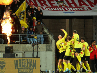 Wellington Phoenix players celebrate a goal against Wrexham during a pre-season friendly at Sky Stadium.