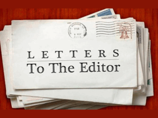 Stack of envelopes with one prominently labelled “Letters To The Editor” on the front.
