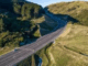 Aerial view of Transmission Gully motorway winding through hills and forest in the Wellington region.