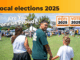 Three people holding hands and walking toward a community event in a park, with election branding that reads “Local elections 2025” and “Are You Porirua Proud?” in the foreground. Banners for Pōti 2025 and Vote 2025 are also visible.