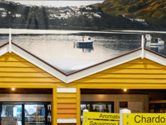 Interior view of Moore Wilson’s Porirua with yellow replica boatshed facades and a large mural of Mana Island and boats in the background