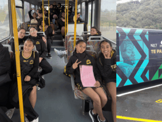 Group of school-aged children sitting inside a community bus and smiling at the camera; side view of Te Pahi bus with Māori artwork and Porirua City Council branding.