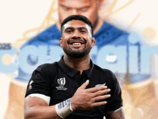 Ardie Savea holding a trophy at the New Zealand Rugby Awards ceremony.