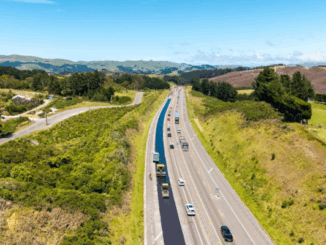 Road cones and traffic control signs along a highway near Porirua during maintenance work.