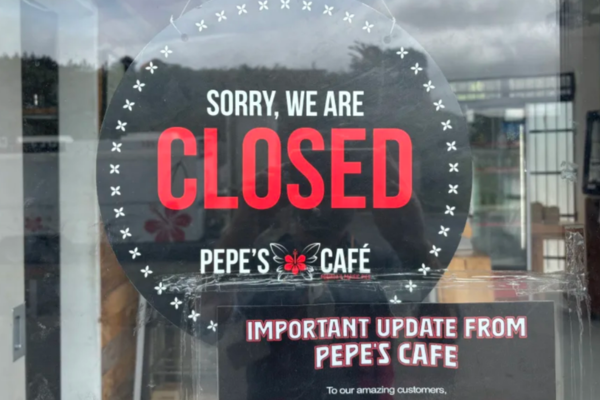 Closed sign displayed on the door of Pepe’s Cafe in Porirua.