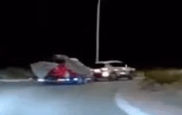 Police appeal for information about a white SUV towing a red Holden on Transmission Gully.