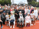 Members and supporters of Titahi Bay Tennis Club gather on the courts during centenary celebrations marking 100 years since the club was founded.