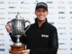 Golfer Daniel Hillier smiles while holding the New Zealand Open trophy after winning the tournament at Millbrook Resort in Arrowtown.