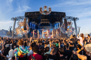 Crowd gathers in front of a large stage at an ULTRA music festival event