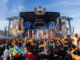 Crowd gathers in front of a large stage at an ULTRA music festival event