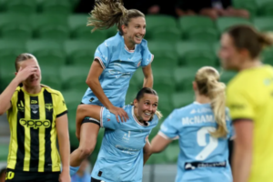 Melbourne City players celebrate during the Ninja A-League Women grand final against Wellington Phoenix at AAMI Park, while Phoenix players react after conceding a goal.