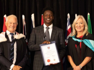 Ethan Mupariwa holds his Wellington College Courtney O’Connor Scholarship certificate at the International College of Management, Sydney scholarship ceremony.