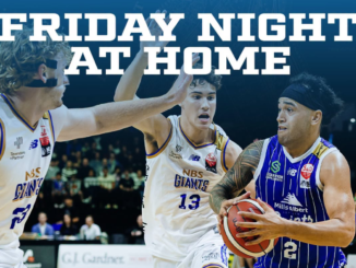 A Wellington Saints player drives with the ball against two Nelson Giants defenders, with “Friday Night at Home” text across the image.