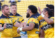 Alt text: Hurricanes players celebrate during a Super Rugby Pacific match in Wellington.