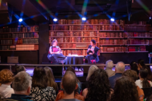 Two writers in conversation on stage before an audience at the Verb Readers & Writers Festival.