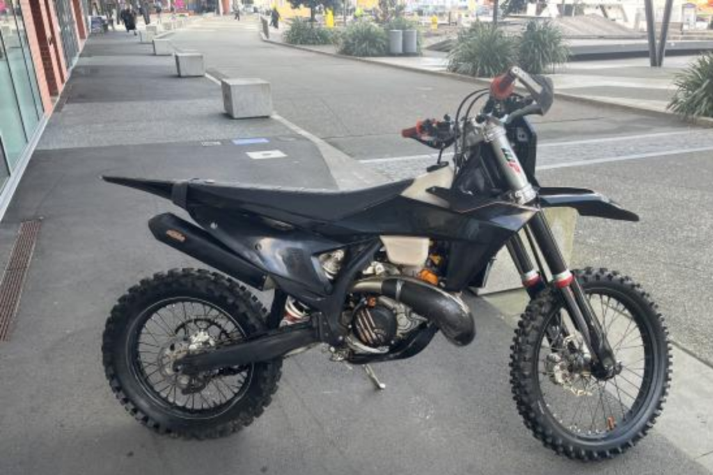 Black dirt bike parked on the Wellington waterfront after being recovered following an alleged joyride through the central city.