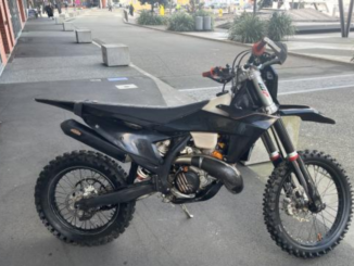 Black dirt bike parked on the Wellington waterfront after being recovered following an alleged joyride through the central city.