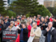 Wellington residents gather outside Parliament during a protest over Tiaki Wai water charges.