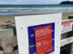 Temporary untreated wastewater discharge warning sign on Wellington’s South Coast beach following the Moa Point wastewater treatment plant failure.