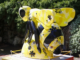 Yellow and black giant bee sculpture decorated with floral patterns in the Wellington Botanic Garden.