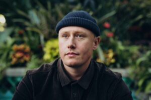 Wellington musician Louis Baker wearing a dark jacket and beanie.