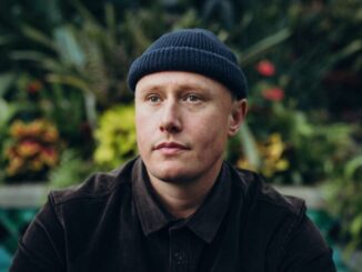 Wellington musician Louis Baker wearing a dark jacket and beanie.